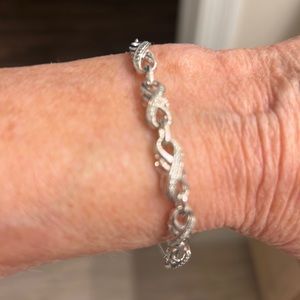 Lovely adjustable infinity design bracelet. Silver glitter.
